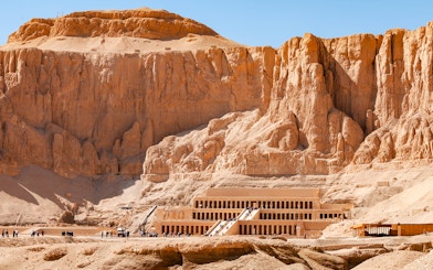 Hatshepsut Temple in Luxor's Valley of the Kings with tourists exploring.