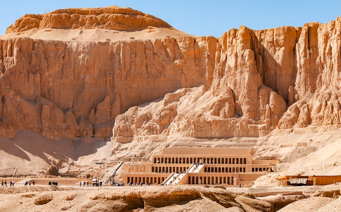 Hatshepsut Temple in Luxor's Valley of the Kings with tourists exploring.