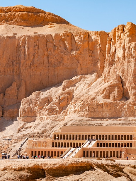 Hatshepsut Temple in Luxor's Valley of the Kings with tourists exploring.