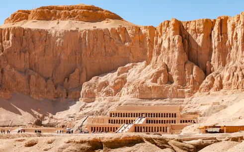 Hatshepsut Temple in Luxor's Valley of the Kings with tourists exploring.