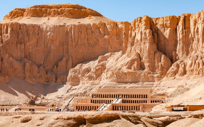 Hatshepsut Temple in Luxor's Valley of the Kings with tourists exploring.