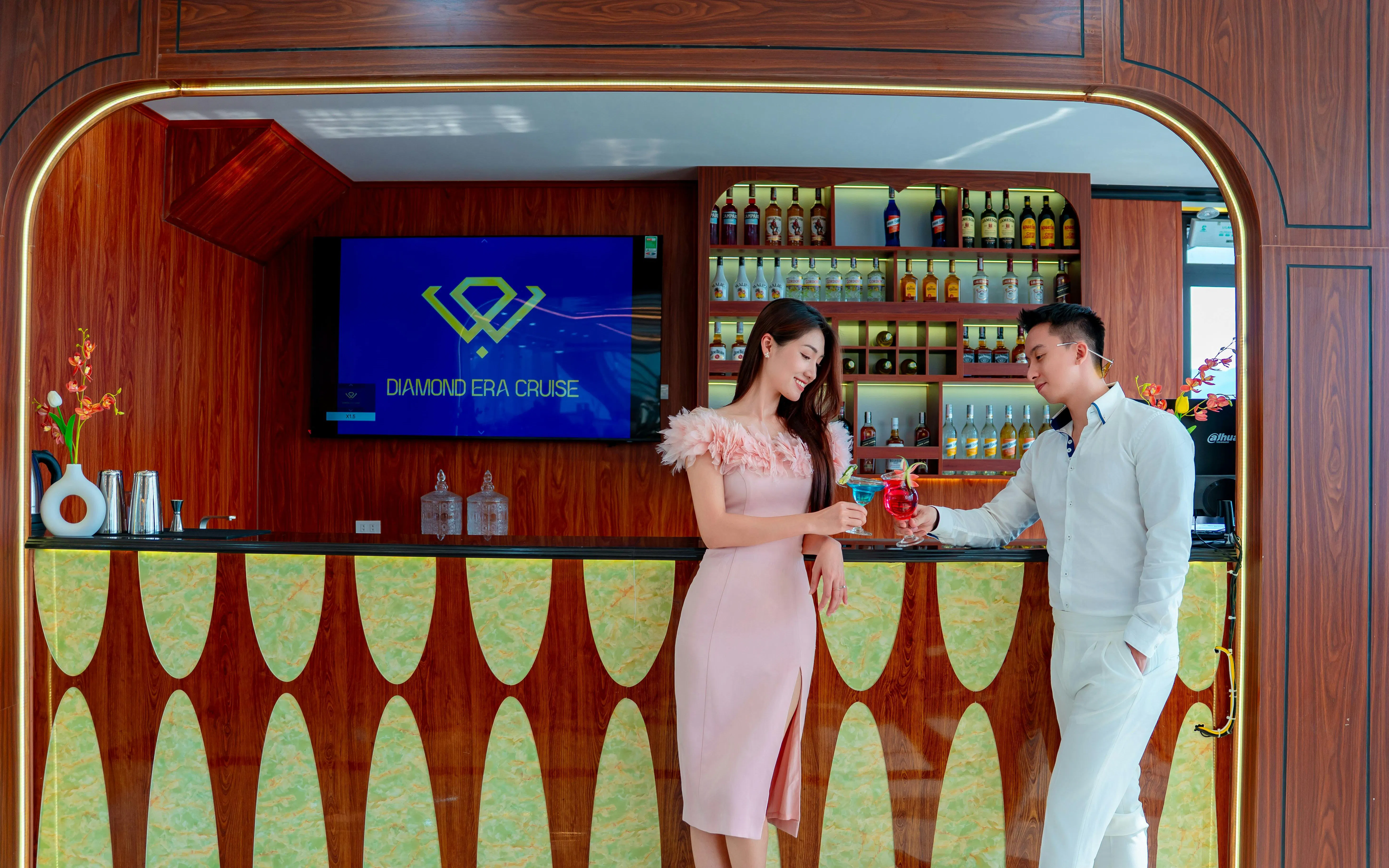 Couple enjoying drinks at the bar on Ha Long Bay's Diamond Era Luxury Day Cruise.