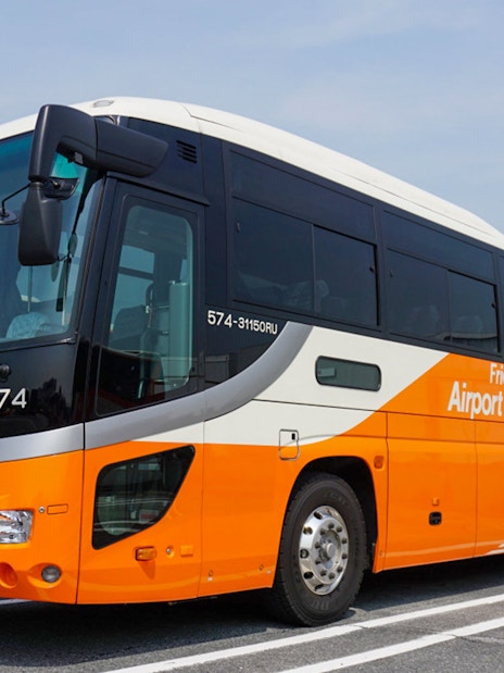 Bus for Narita Airport to Central Tokyo transfer service in parking area.