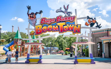 Bugs Bunny BoomTown entrance at Six Flags Over Georgia with colorful play structures.