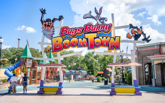 Bugs Bunny BoomTown entrance at Six Flags Over Georgia with colorful play structures.