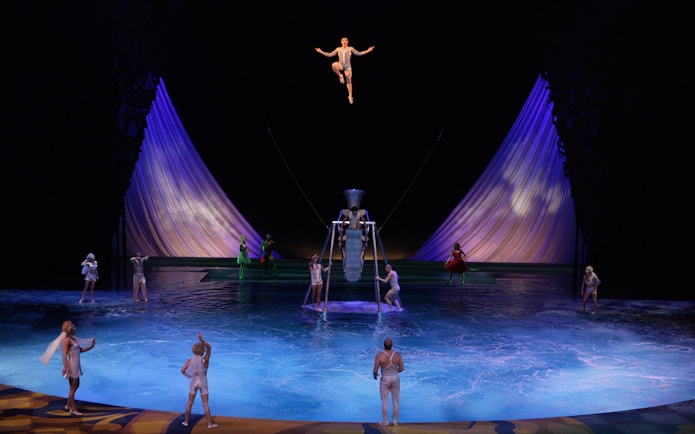 Acrobats performing above water in Cirque du Soleil's "O" show in Las Vegas.