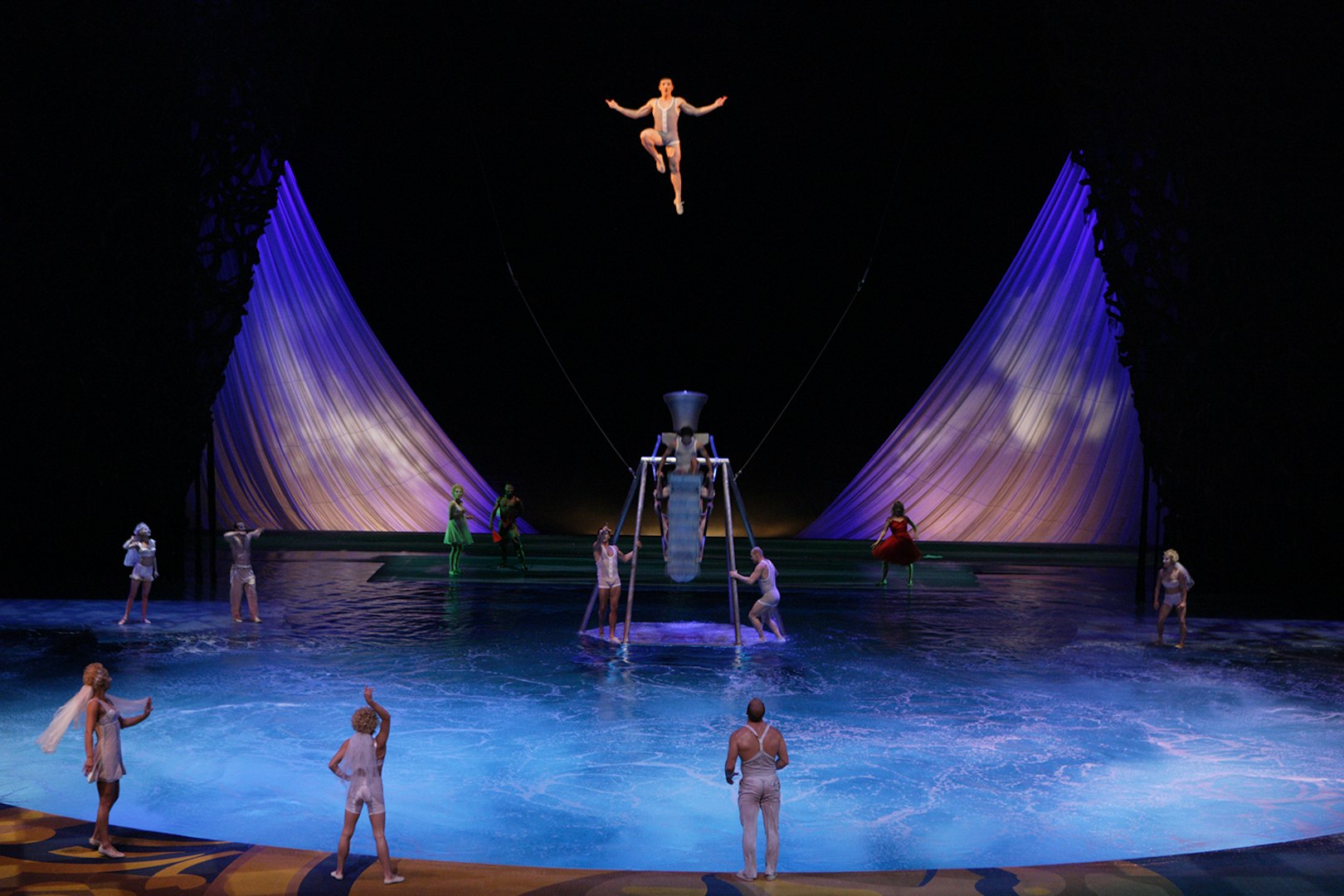 Acrobats performing above water in Cirque du Soleil's "O" show in Las Vegas.