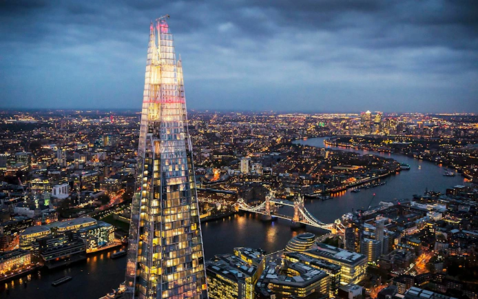 London skyline view from the Shard with Tower Bridge and city lights.