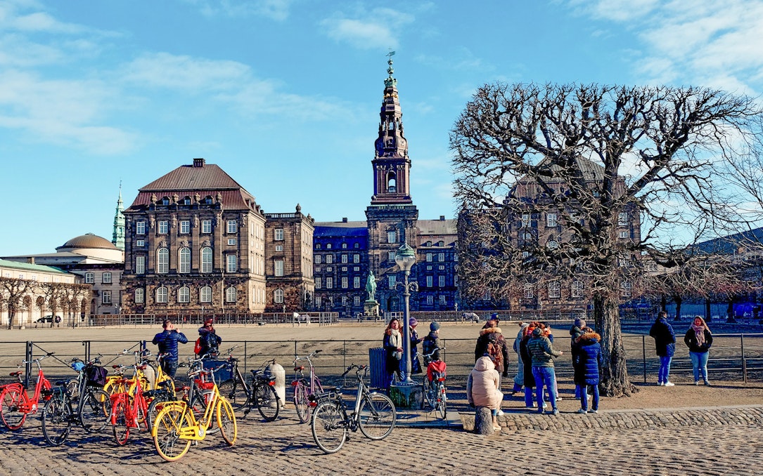 Christiansborg Palace with tourists and bicycles, Copenhagen Highlight Tour.