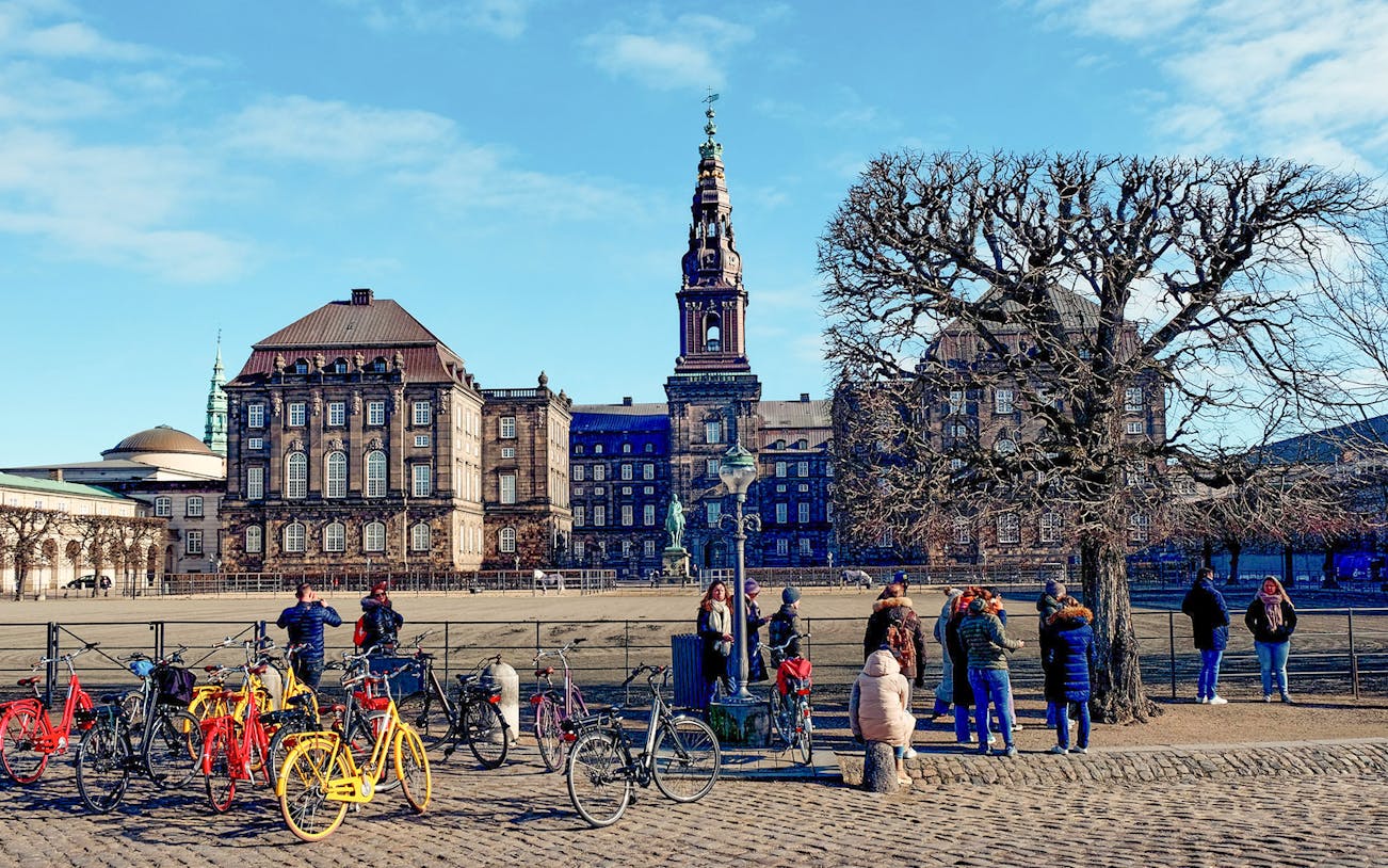 Christiansborg Palace with tourists and bicycles, Copenhagen Highlight Tour.