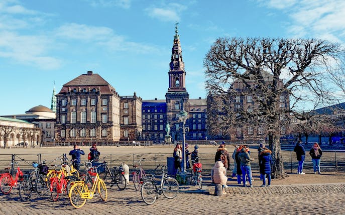 Christiansborg Palace with tourists and bicycles, Copenhagen Highlight Tour.