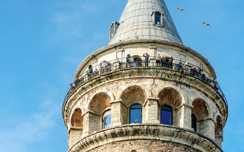 Aerial view of Galata Tower with visitors on the observation deck, Istanbul.