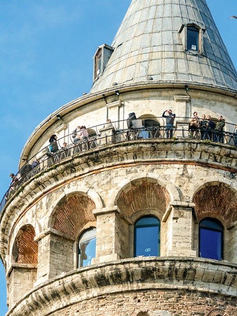 Aerial view of Galata Tower with visitors on the observation deck, Istanbul.