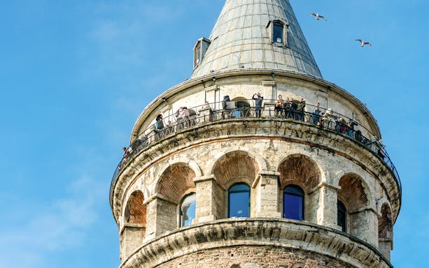 Aerial view of Galata Tower with visitors on the observation deck, Istanbul.