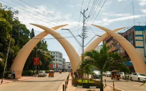 Mombasa tusks landmark on Moi Avenue during guided city tour.