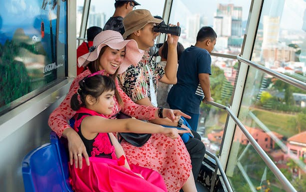Family enjoying the view from Menara Taming Sari in Melaka.