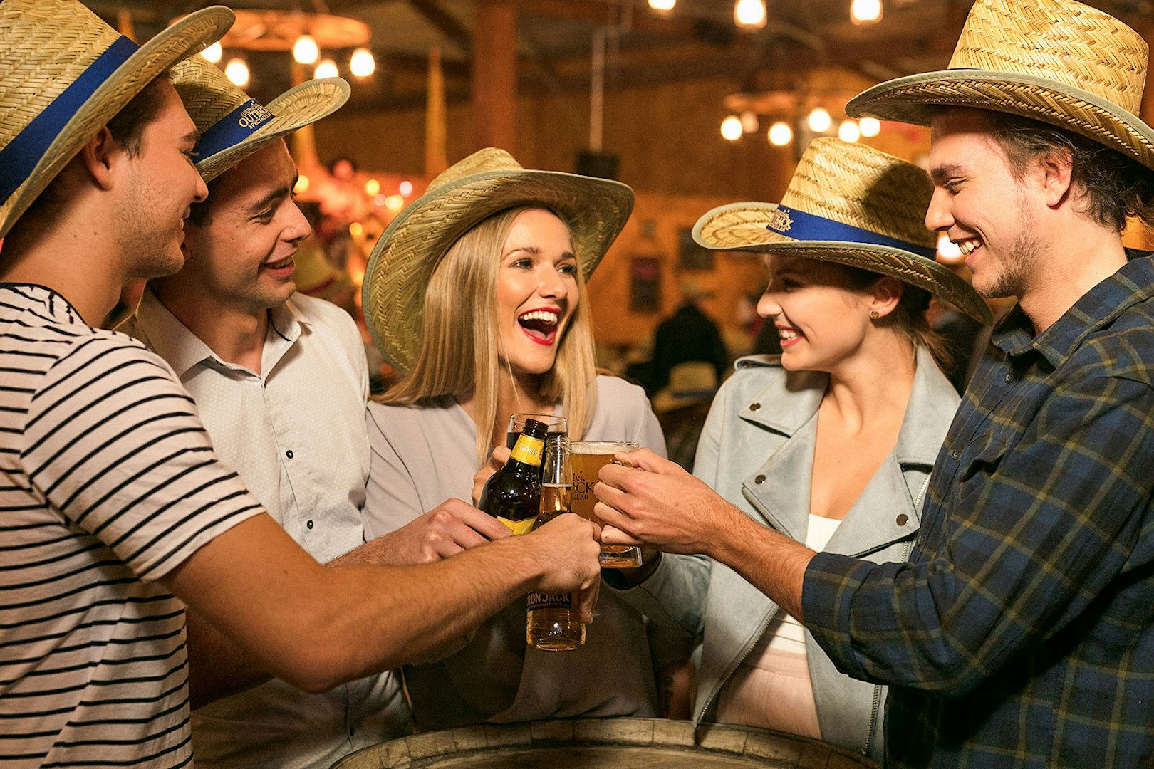 People toasting with drinks at Australian Outback Spectacular Heartland Show.