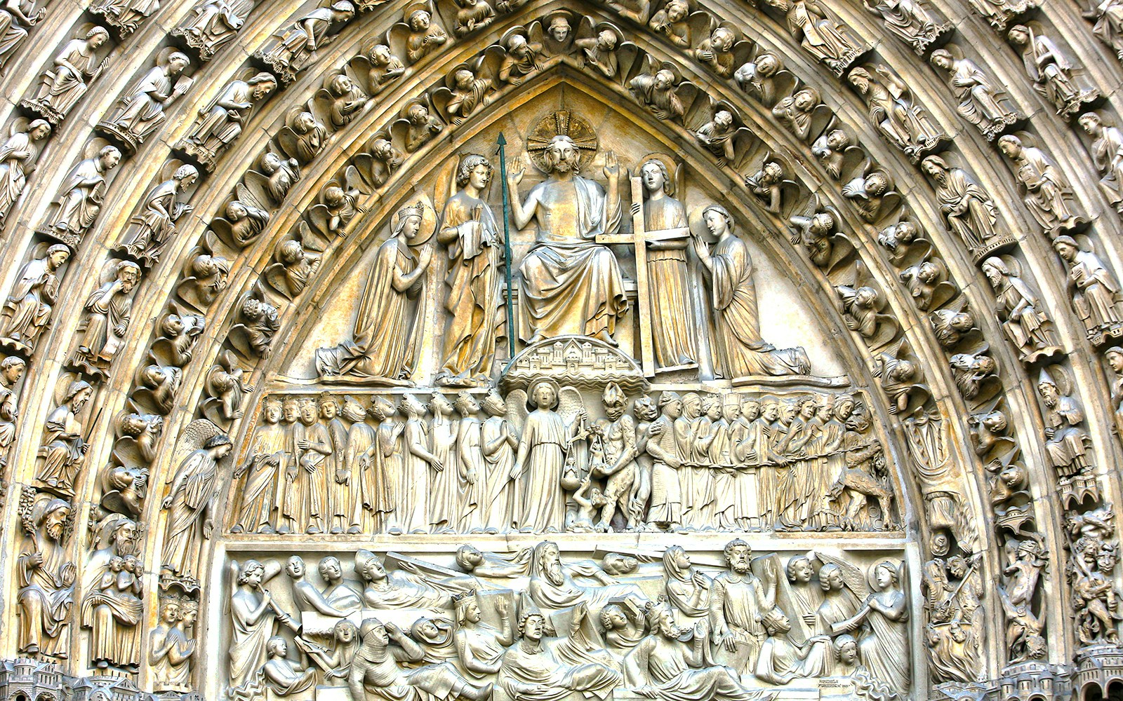 Notre-Dame Last Judgment sculpture detail in Paris, France, showcasing intricate medieval craftsmanship.