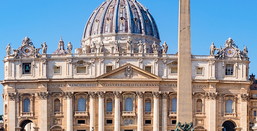 St Peter's Basilica facade with obelisk in Vatican City, Rome.