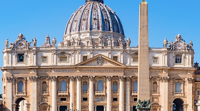 St Peter's Basilica facade with obelisk in Vatican City, Rome.