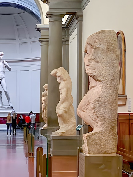 Hall of Prisoners sculptures leading to Michelangelo's David in Accademia Gallery, Florence.