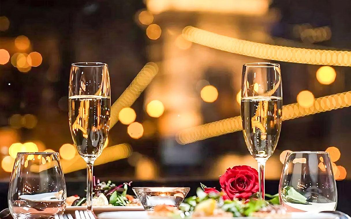 Champagne glasses and dinner setting on Budapest New Year's Eve Danube cruise.