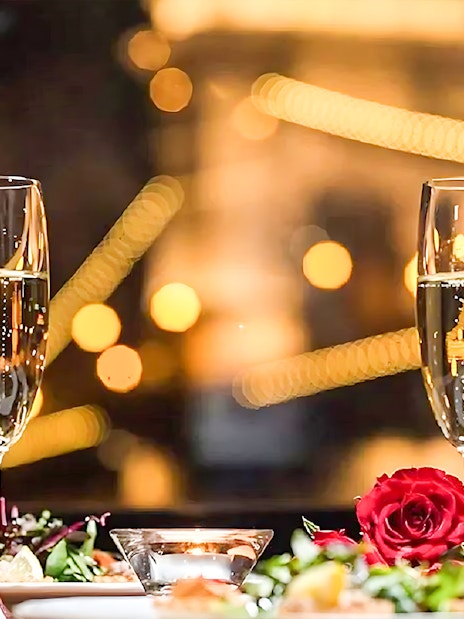 Champagne glasses and dinner setting on Budapest New Year's Eve Danube cruise.
