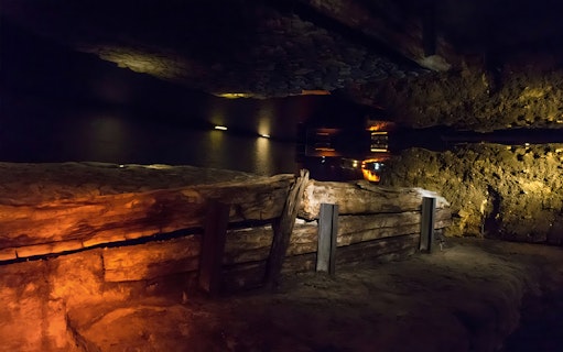 Rynek Underground Museum exhibit with ancient wooden structures in Krakow.