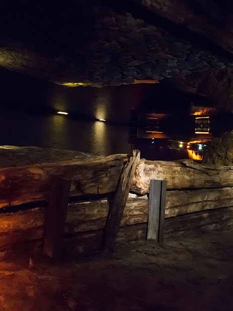 Rynek Underground Museum exhibit with ancient wooden structures in Krakow.
