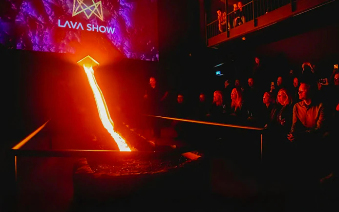 Lava flowing during a live show in Reykjavik with audience watching.