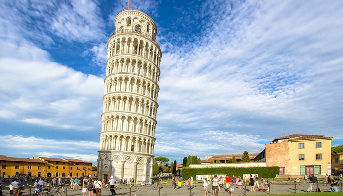 Leaning Tower of Pisa with tourists in Piazza dei Miracoli, Italy.