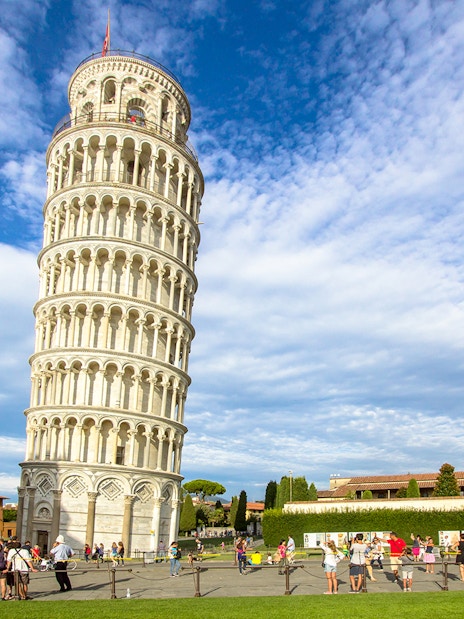 Leaning Tower of Pisa with tourists in Piazza dei Miracoli, Italy.