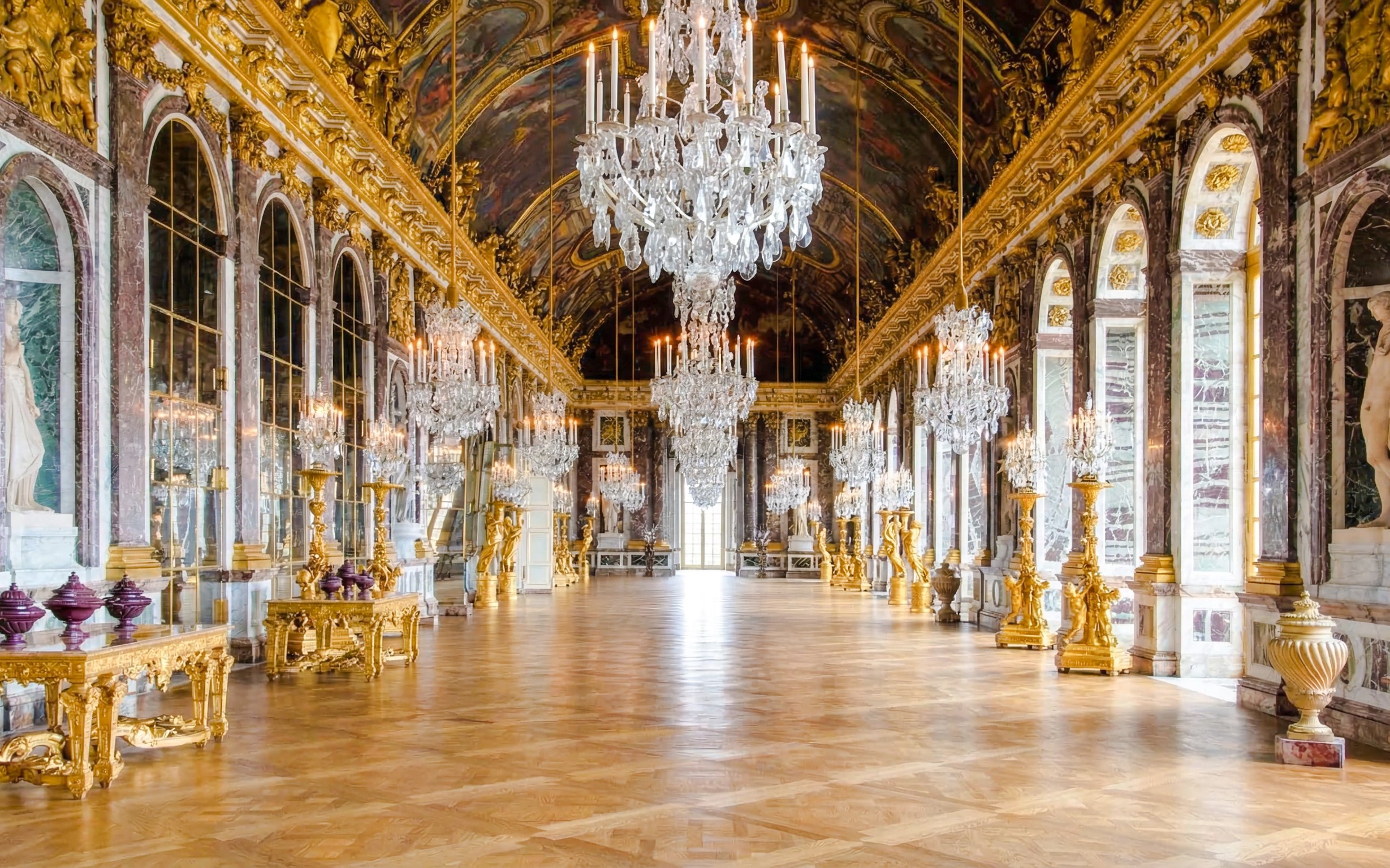 Hall of Mirrors with chandeliers and ornate decor, Palace of Versailles, France.