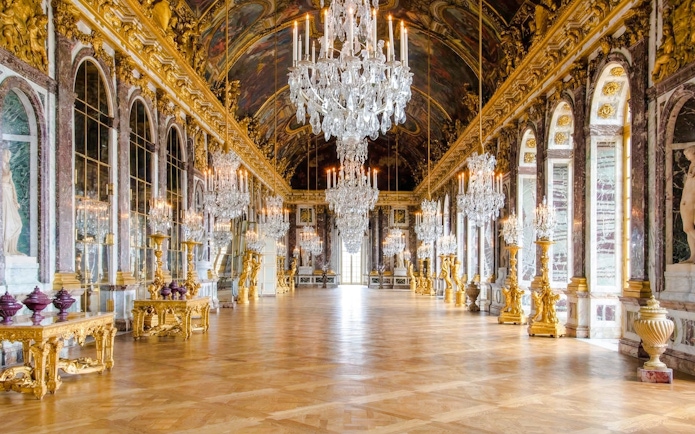 Hall of Mirrors with chandeliers and ornate decor, Palace of Versailles, France.