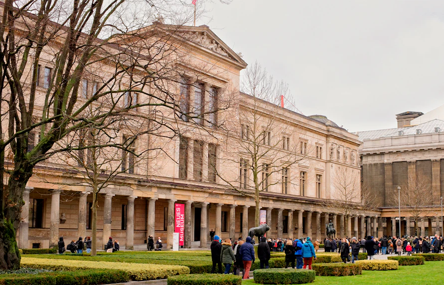 Neues Museum on Museum Island, Berlin, with visitors in the courtyard.