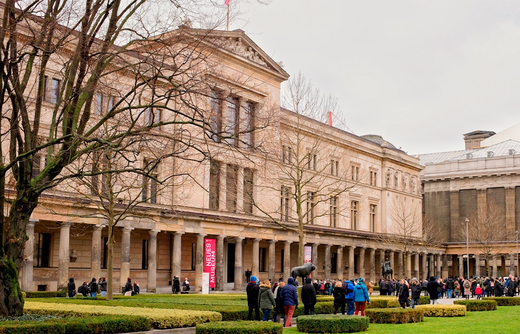 Neues Museum Berlin exterior with visitors in front of the entrance.