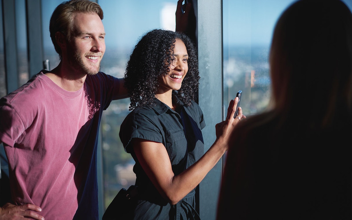Visitors enjoying the view from Melbourne Skydeck during the Ultimate Skydeck Experience.