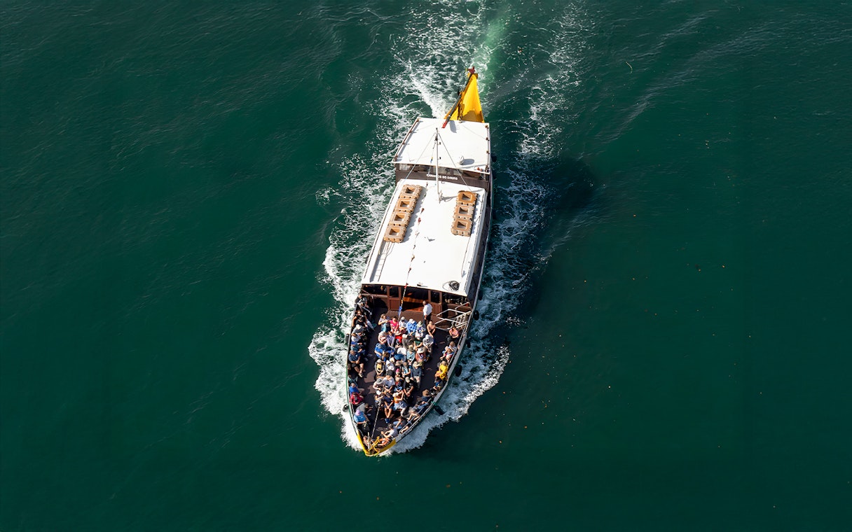 Tourists on a boat during a Porto walking tour cruise trip.