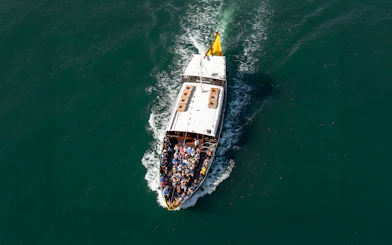 Tourists on a boat during a Porto walking tour cruise trip.