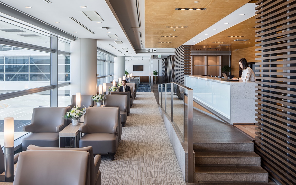Plaza Premium Lounge seating area at Chubu Centrair International Airport with reception desk.