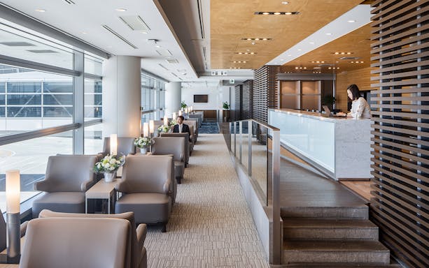 Plaza Premium Lounge seating area at Chubu Centrair International Airport with reception desk.