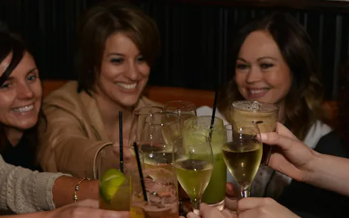 Group toasting with drinks on Perth Bar & Nightlife Walking Tour.