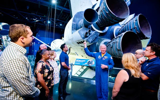 Visitors learning about Space Shuttle Atlantis at Kennedy Space Center, Florida.