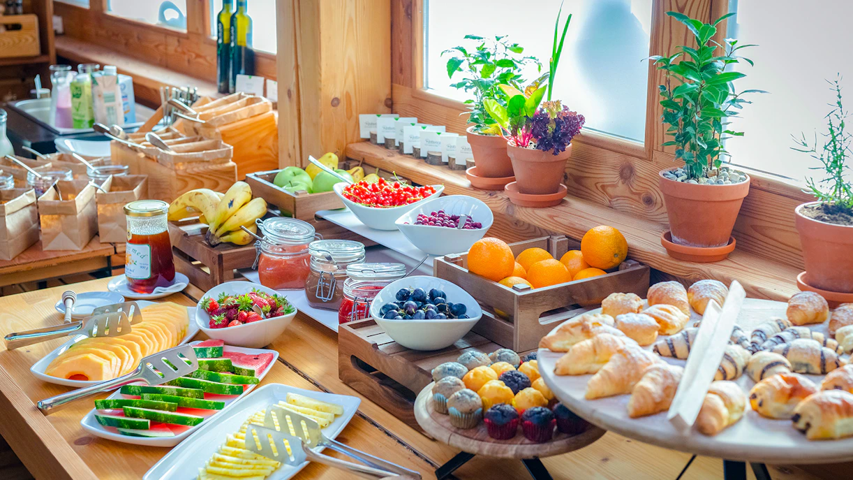 Breakfast buffet with tropical fruits and pastries at Bali Zoo, Indonesia.