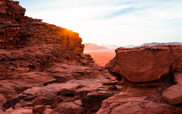 Red rock formations in Wadi Rum desert at sunset, Jordan.
