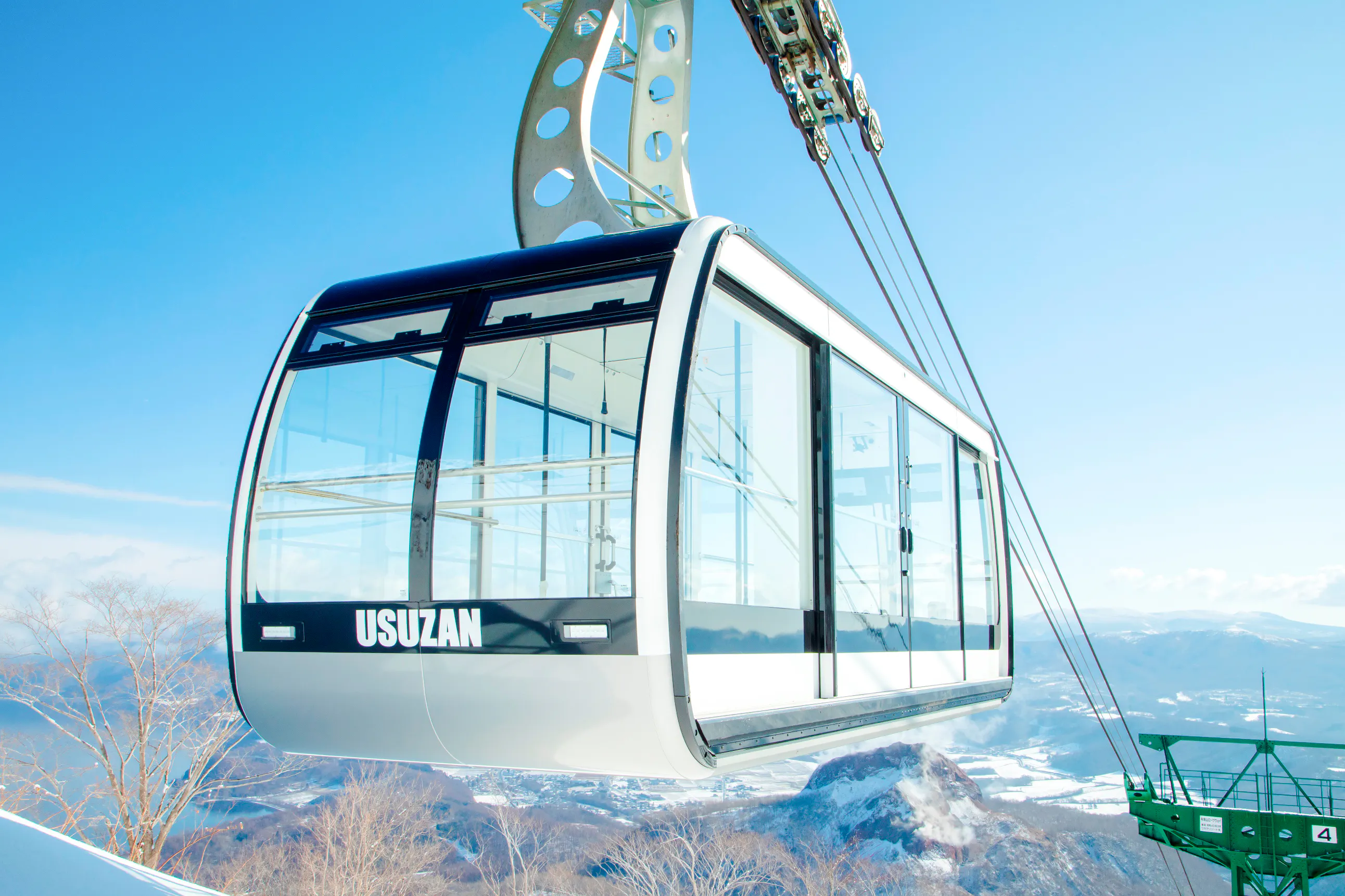 Cable car ascending Mt. Usu with snowy landscape, Hokkaido.
