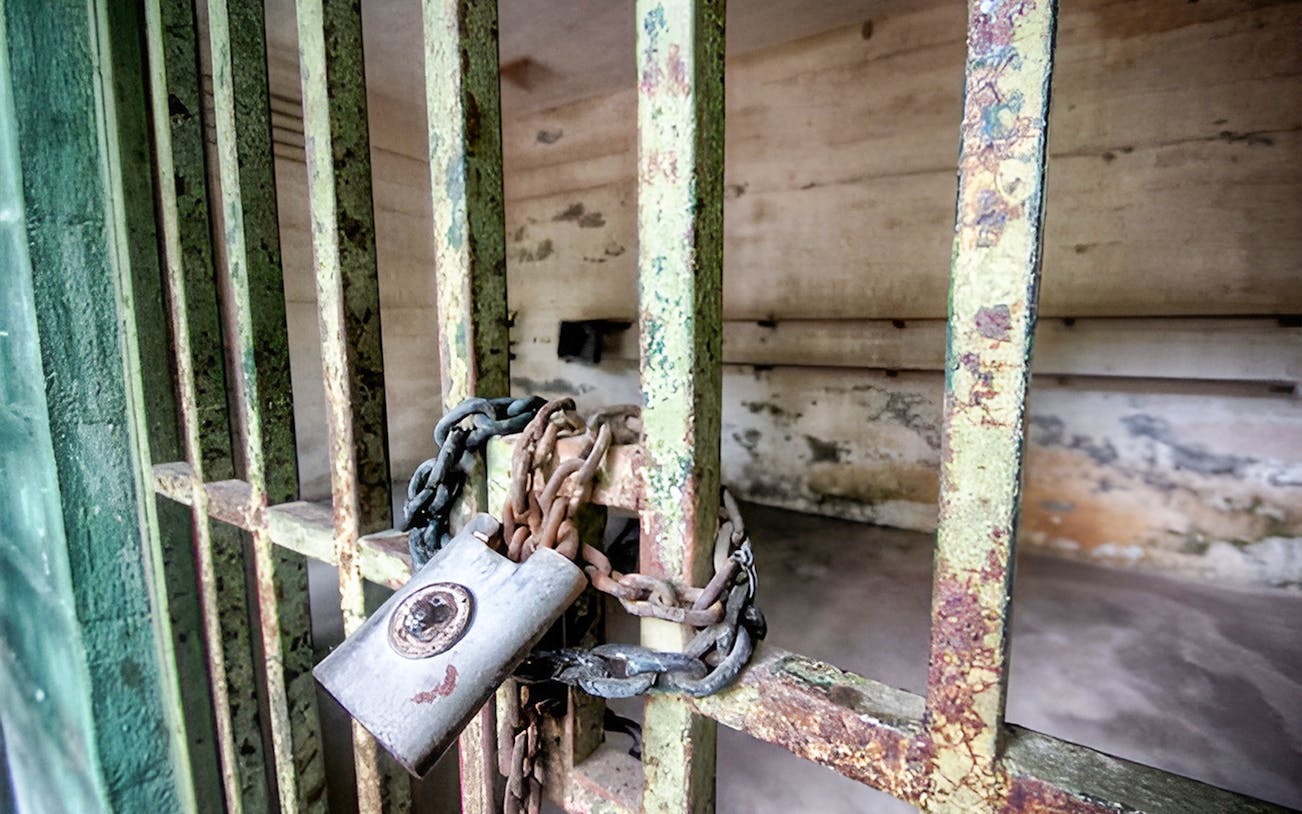 Locked cell door at Penang War Museum, Malaysia.