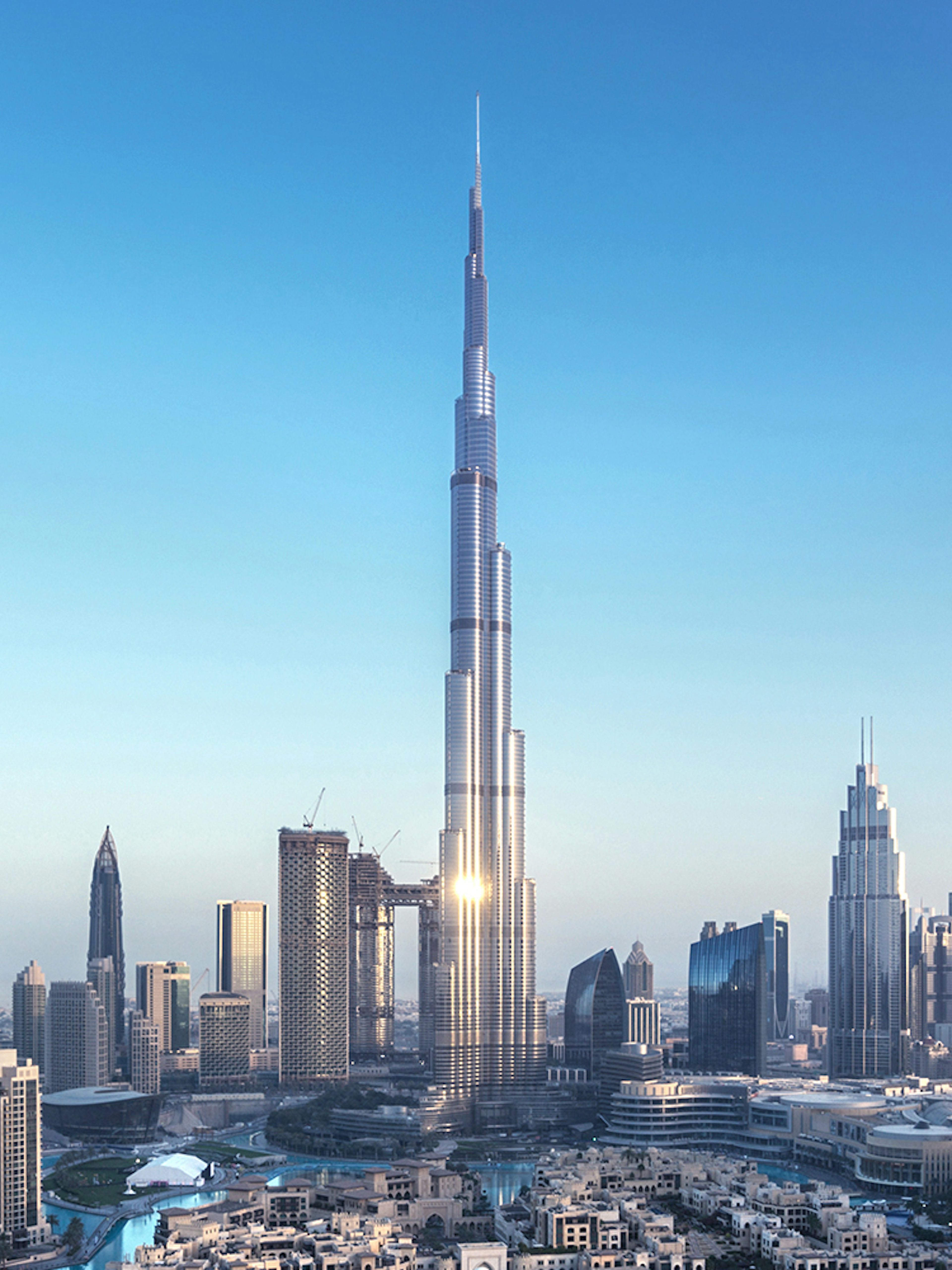 Aerial view of Burj Khalifa in Dubai with surrounding cityscape.