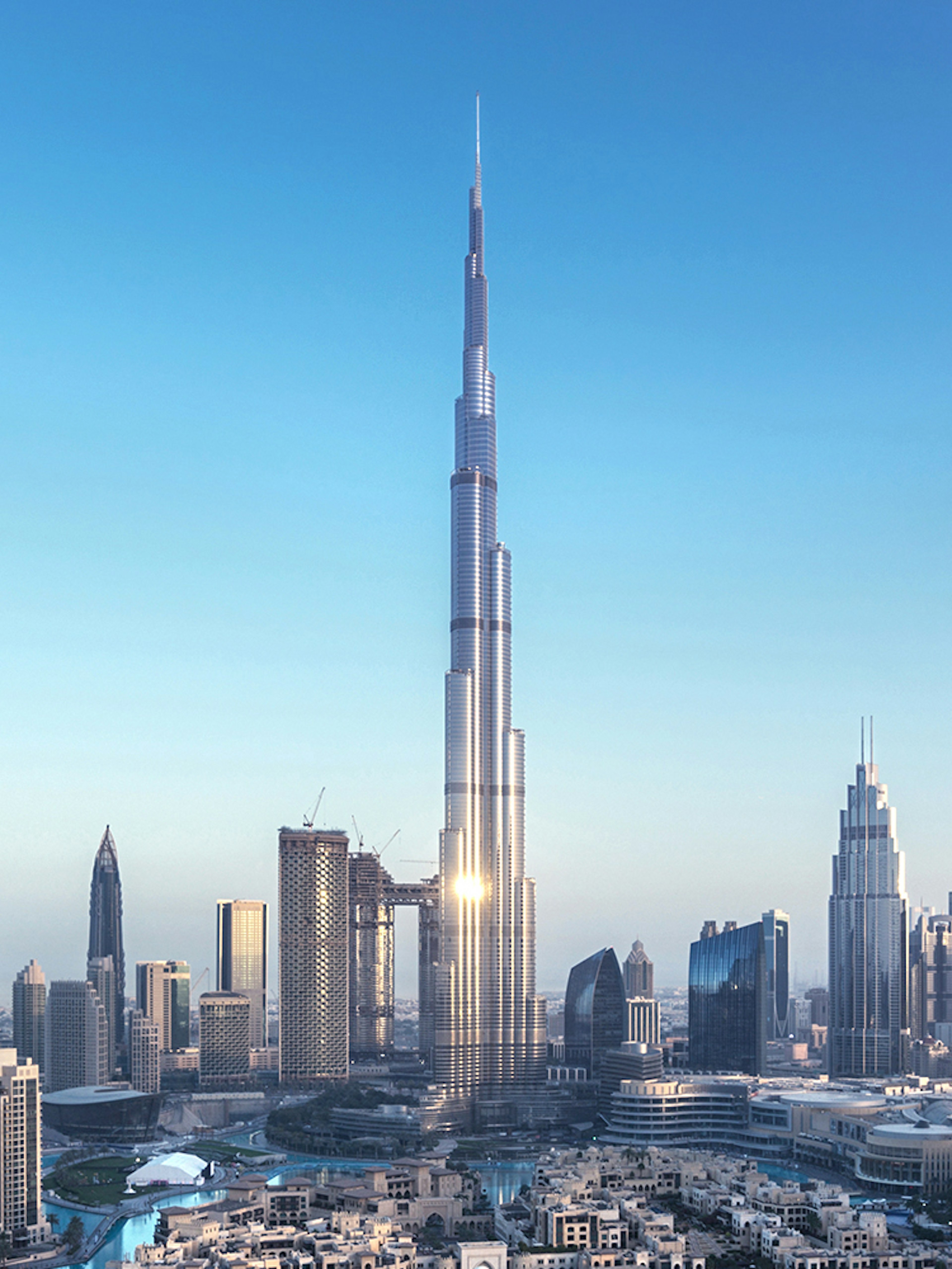Aerial view of Burj Khalifa in Dubai with surrounding cityscape.