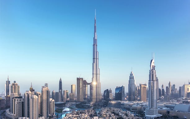 Aerial view of Burj Khalifa in Dubai with surrounding cityscape.